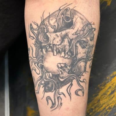 Skull with flames on forearm - Healed